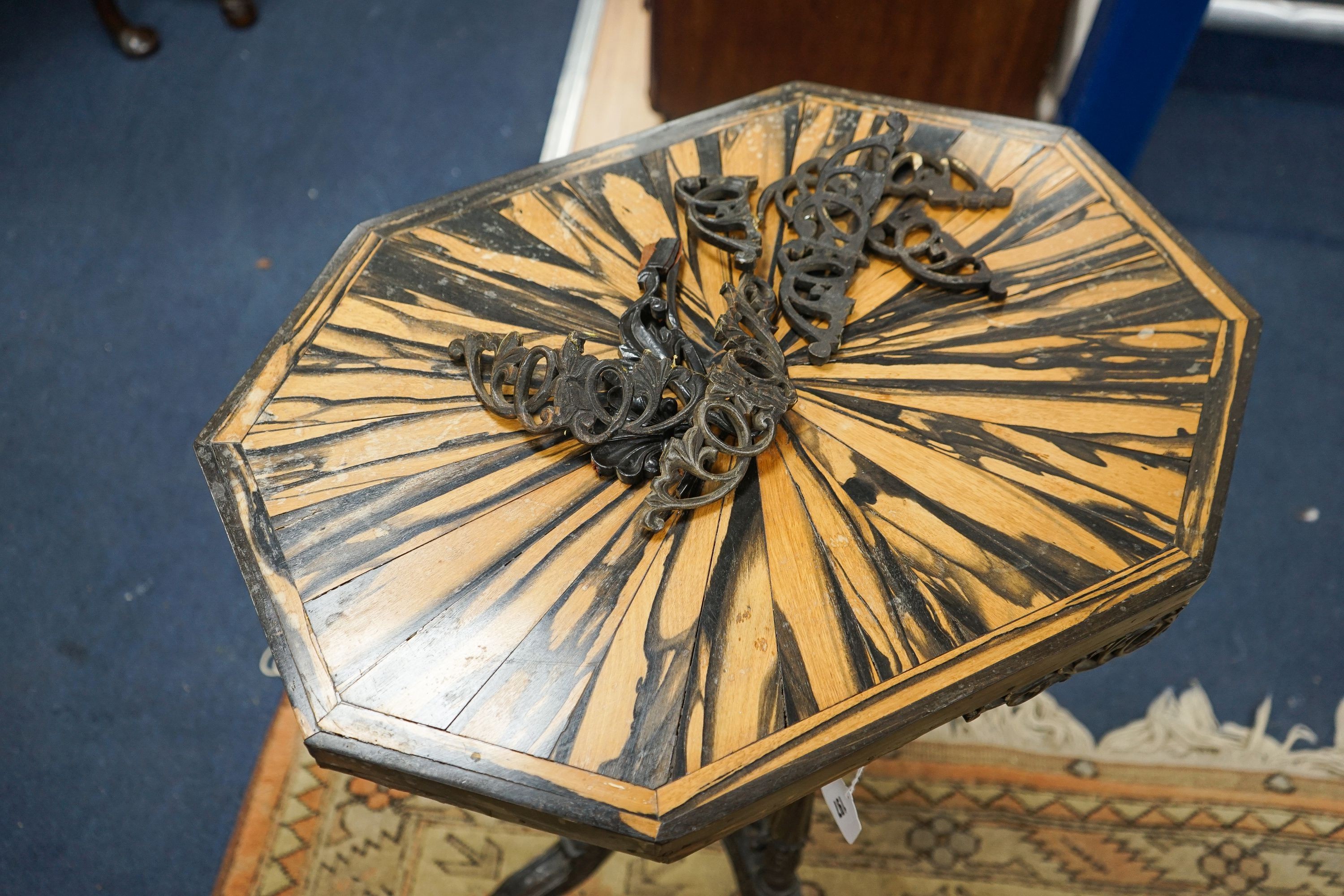 A 19th century Celanese carved ebony and coromandel veneered octagonal occasional table, width 57cm, depth 42cm, height 70cm